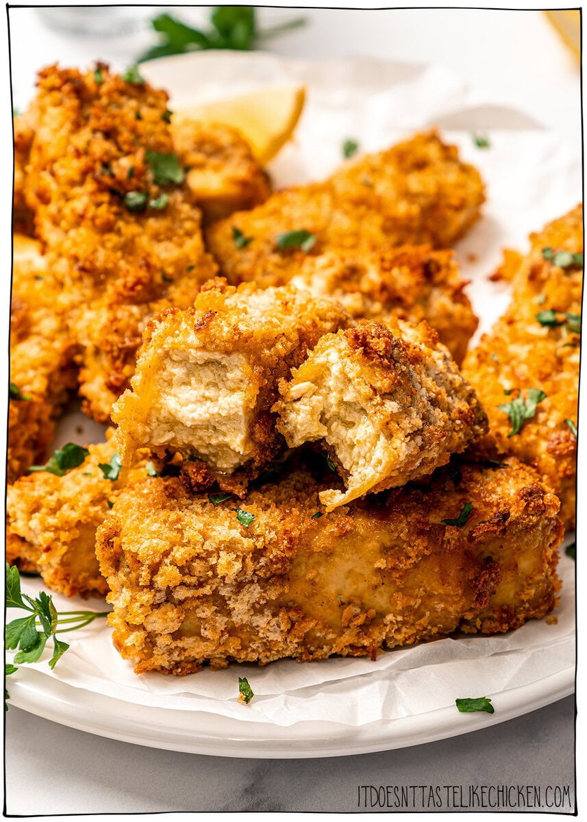 Plate of tofu chicken with sauce, with text overlay that reads vegan chicken fingers. Plate of crispy tofu chicken fingers, with one broken in half to show interior.