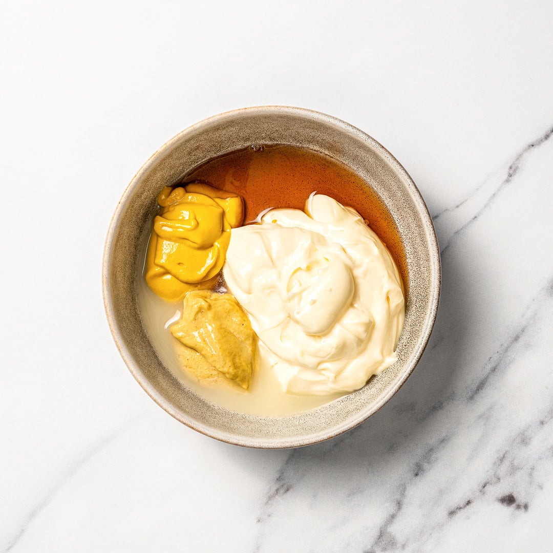 This homemade Vegan Honey Mustard Sauce is creamy, tangy, sweet, and ready in just 5 minutes, perfect for dipping ALL the things! Ingredients for vegan honey mustard sauce in bowl.