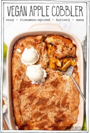 Cobbler in baking dish with serving spoon with text overlay that reads vegan apple cobbler.