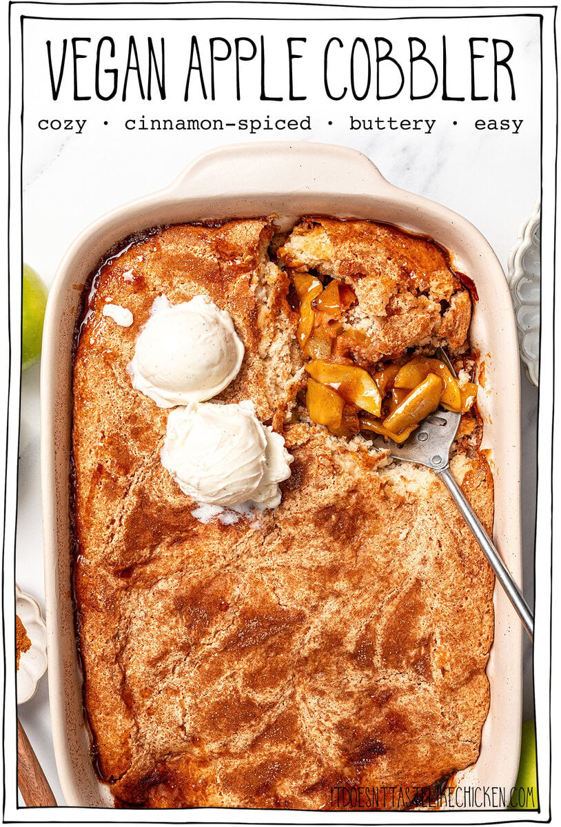 This Easy Vegan Apple Cobbler pairs tender spiced apples with a soft, buttery cake-like topping swirled with cinnamon sugar. So delicious! Cobbler in baking dish with serving spoon with text overlay that reads vegan apple cobbler.