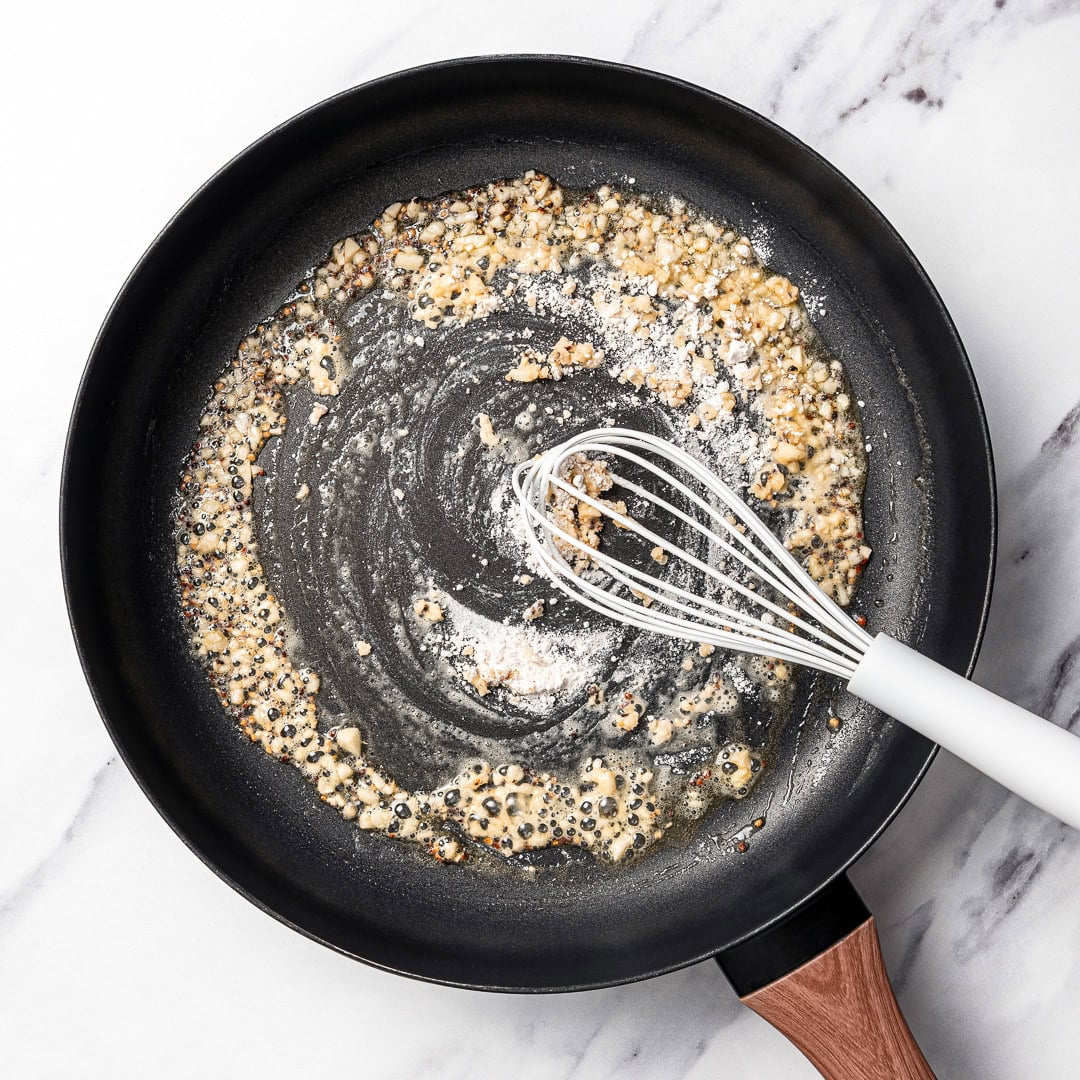 Cacio e pepe butter beans are creamy, peppery, and packed with buttery beans in a cheesy vegan sauce inspired by the classic Italian pasta! Whisking flour into skillet with garlic.
