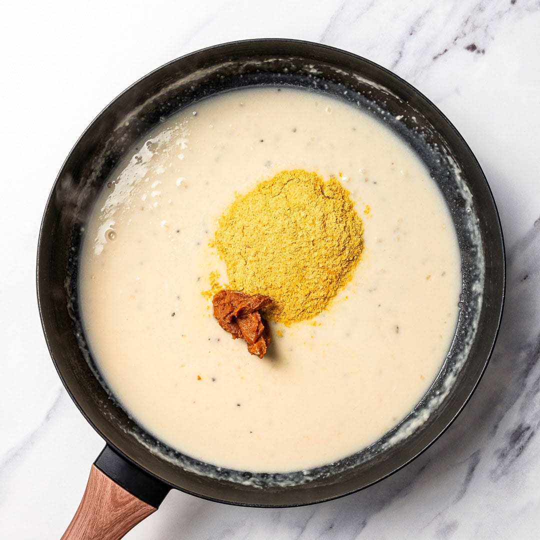 Cacio e pepe butter beans are creamy, peppery, and packed with buttery beans in a cheesy vegan sauce inspired by the classic Italian pasta! Miso and nutritional yeast added to cream sauce.