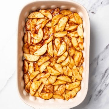 Apples in baking dish for cobbler.