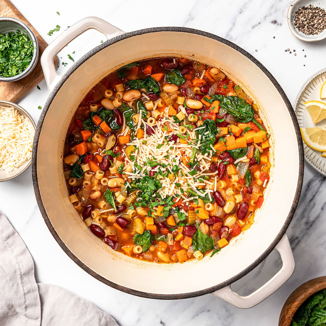 This vegan pasta e fagioli soup is hearty, cozy, and loaded with beans, pasta, and vegetables in a rich tomato broth. A budget-friendly meal! Pot of vegan pasta e fagioli soup.