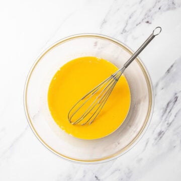 Whisk in bowl with pumpkin mixture.