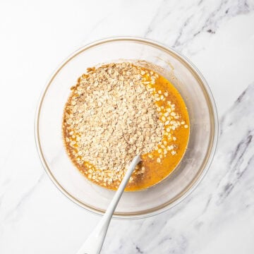 Oats added to bowl of pumpkin mixture.